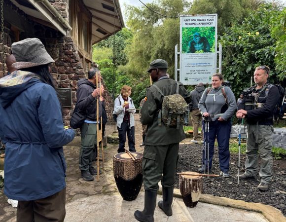 Tourists and a ranger guide standing next to each other