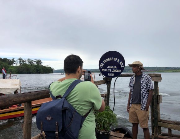 A man taking a photo of another man at a tourist site