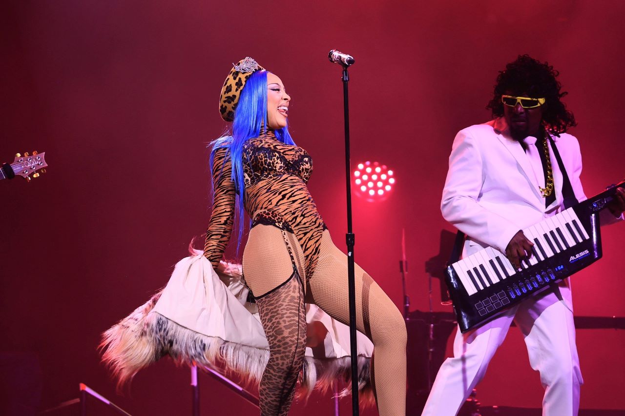 A female musician and a make keyboard player performing