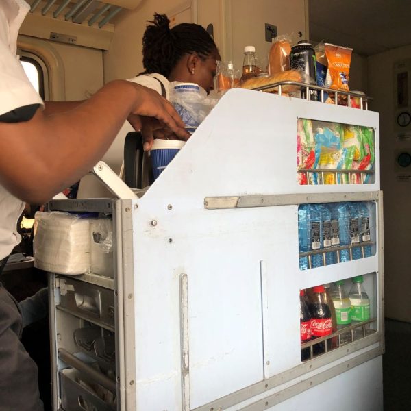 White mobile cart with snacks and drinks 