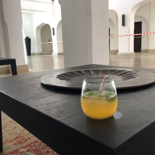 A glass of juice on a black wooden table