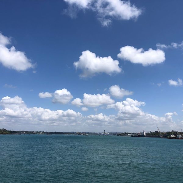 Clear blue waters and a clear blue sky with white clouds