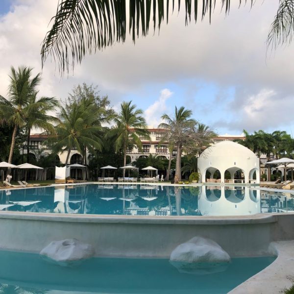 Swimming pool with trees surrounding it 