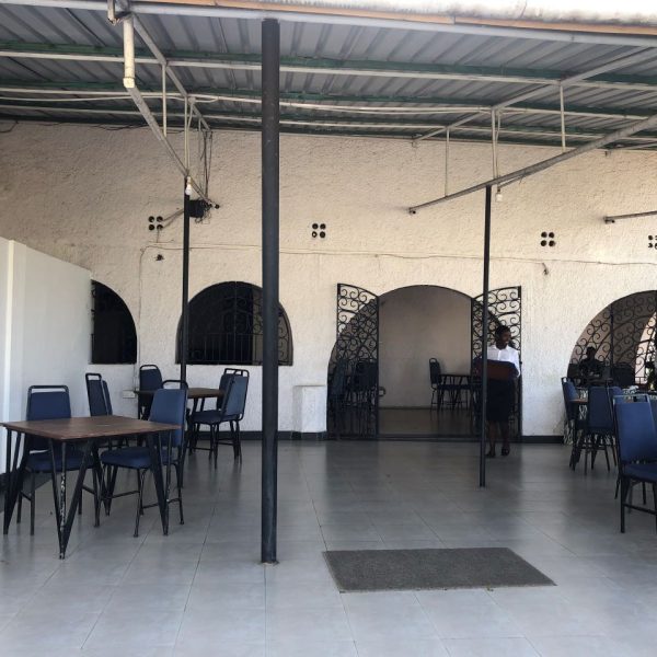 Blue chairs in a white building 
