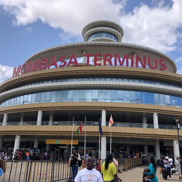 People in front of a dome shaped building 