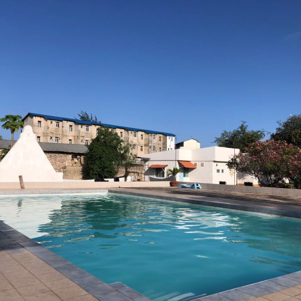 A swimming pool with blue water 