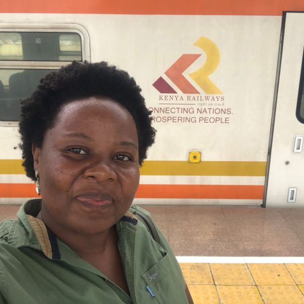 A woman wearing a green shirt 