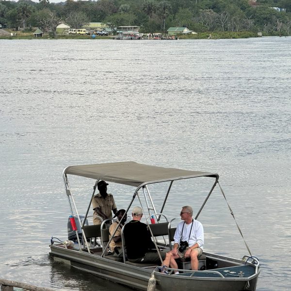 Men on a small boat on water 