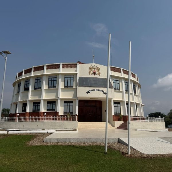 A white building with a large brown door