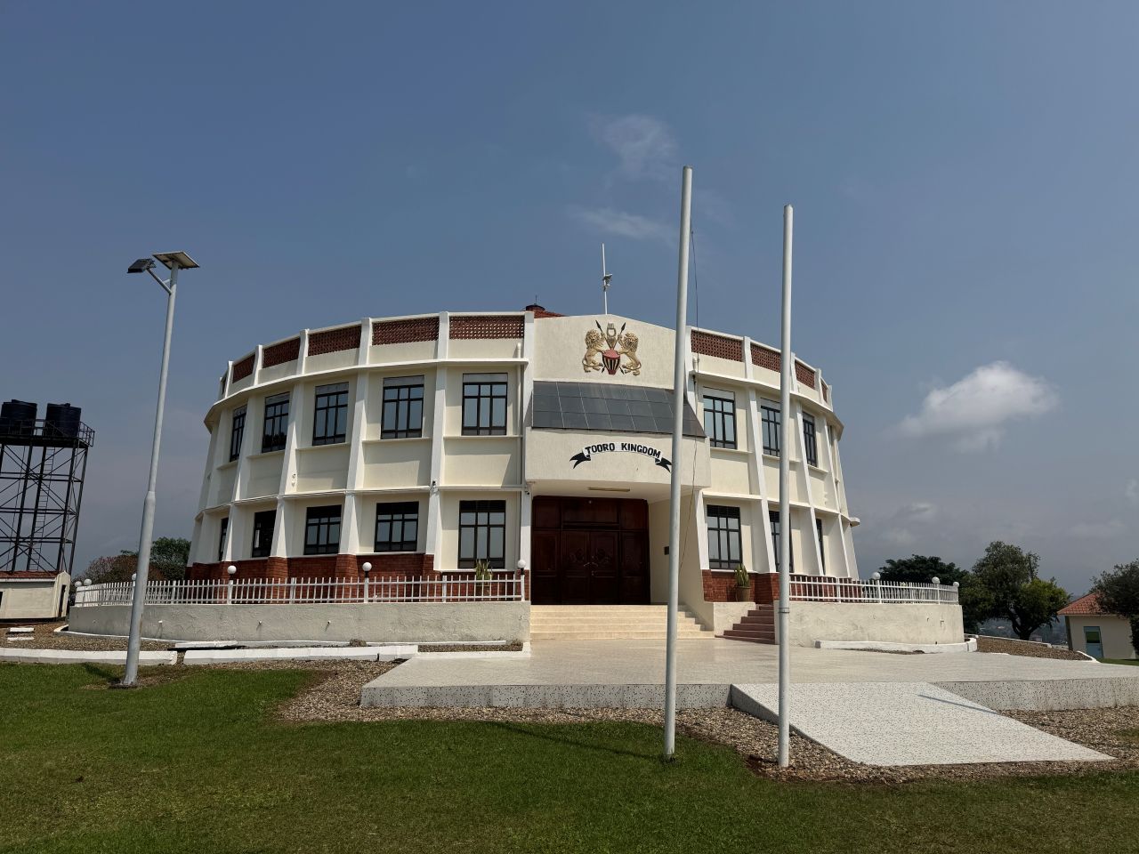 A white building with a large brown door